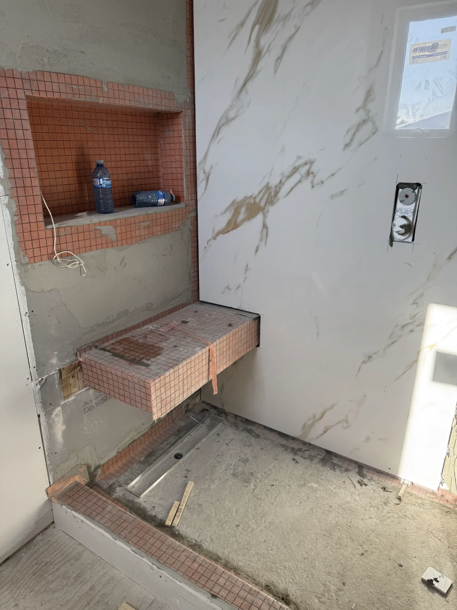 Large slab being installed in shower