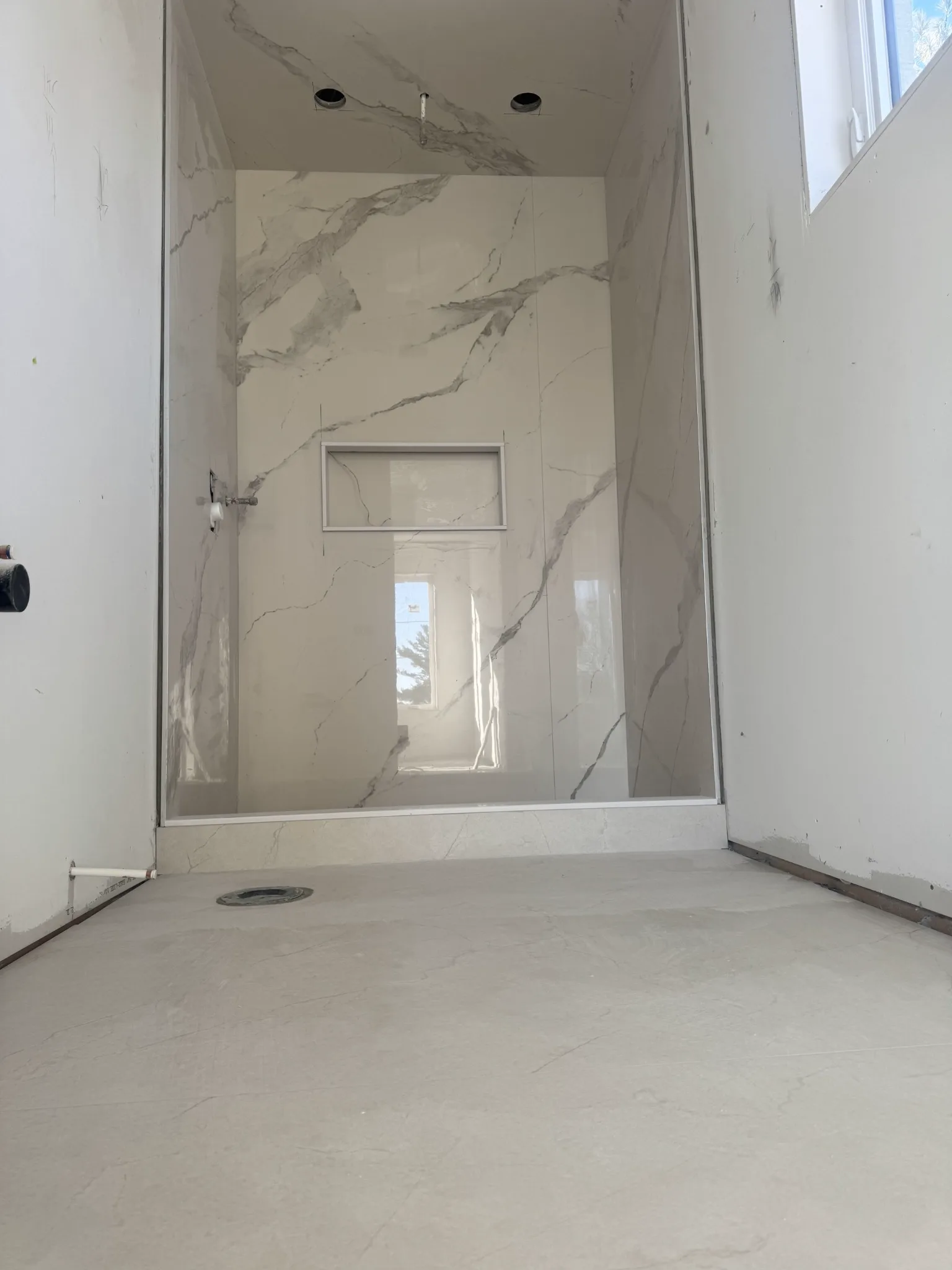Completed tiled shower base